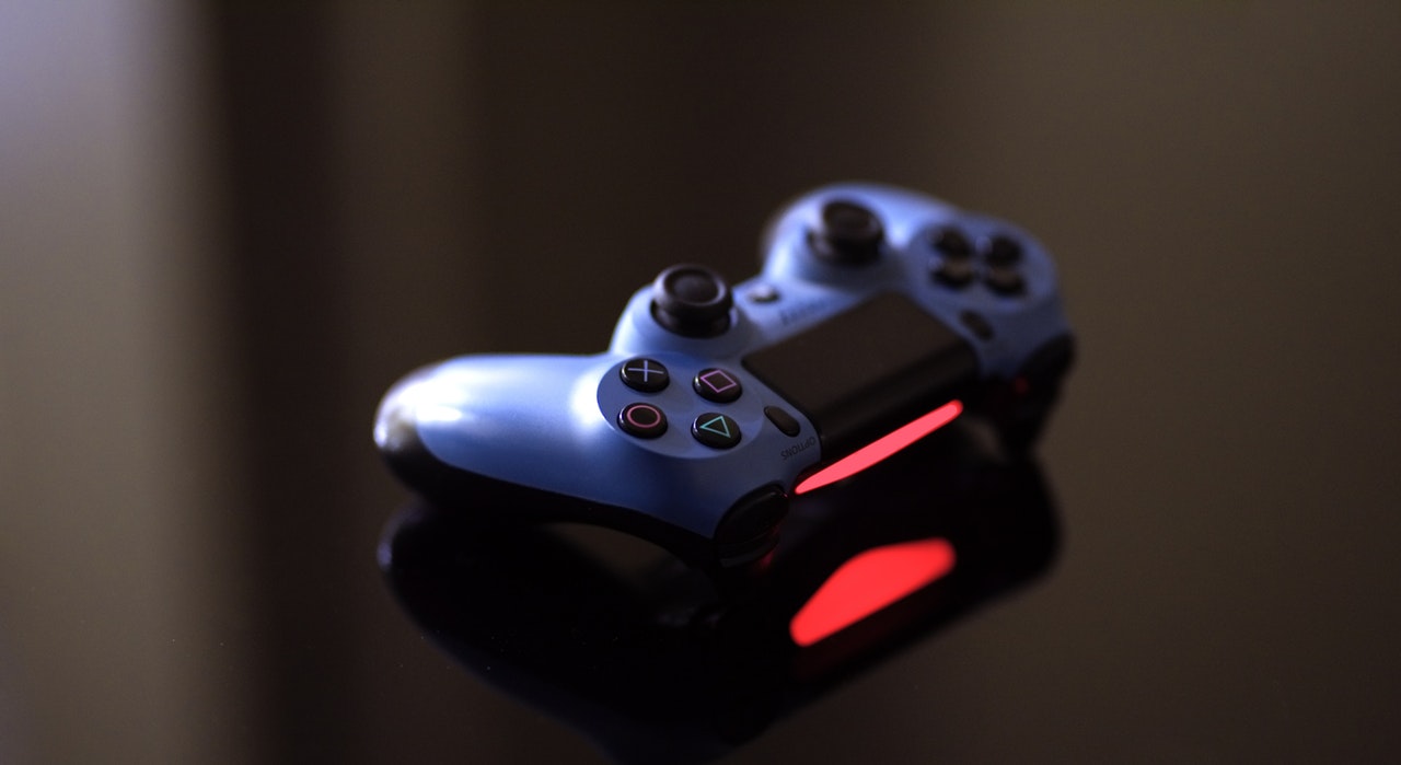 a game controller on black surface